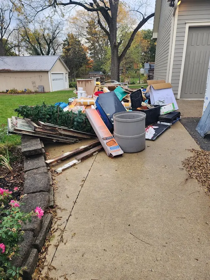 Dumpster being loaded with debris for Residential Dumpster Rental in Chalco